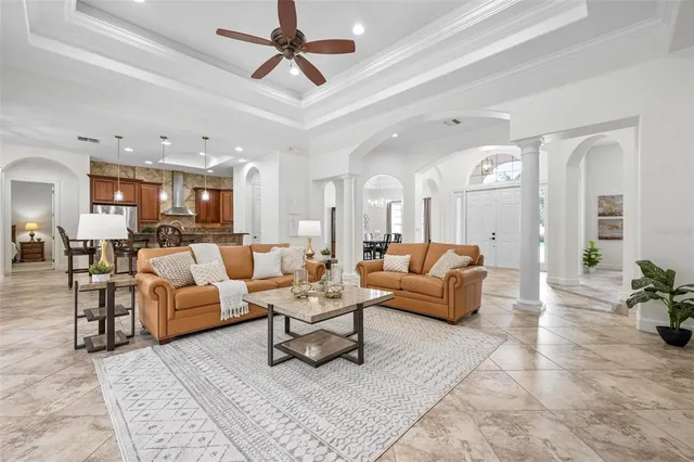a view of a dining room with furniture and a window