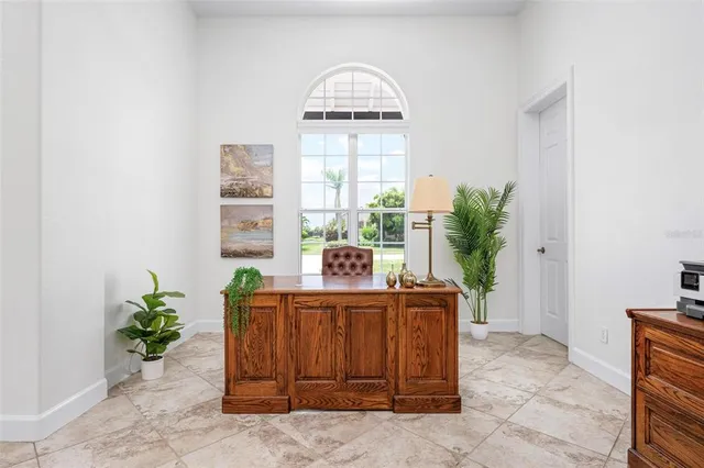 a bedroom with a bed and ceiling fan