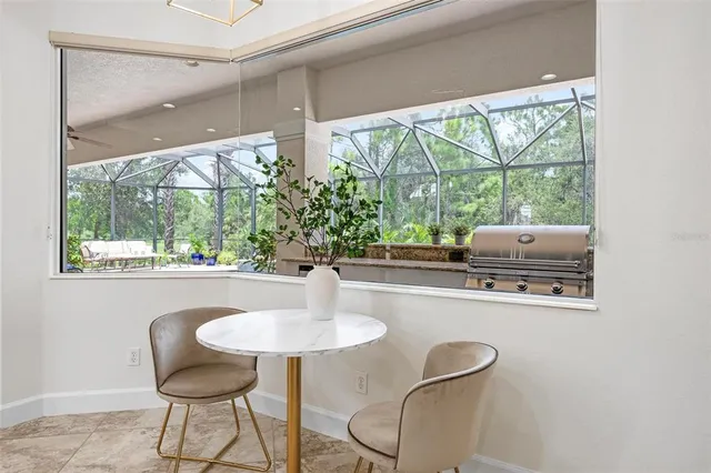 a spacious bedroom with a bed and a chandelier