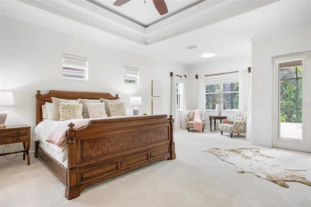 a view of backyard with outdoor seating and green space