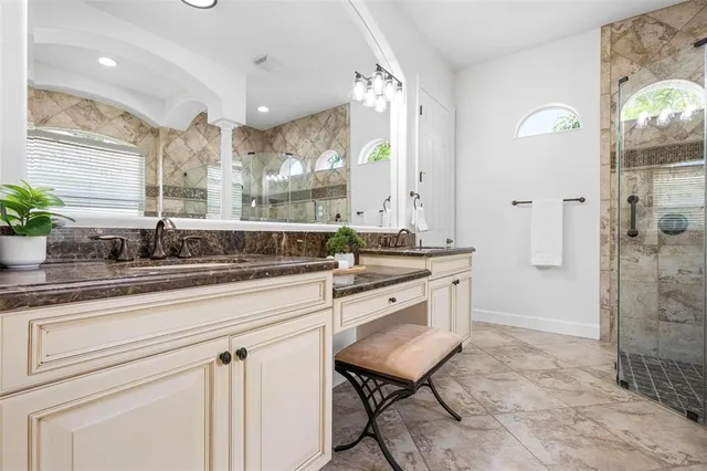 a view of a patio with a table and chairs under an umbrella