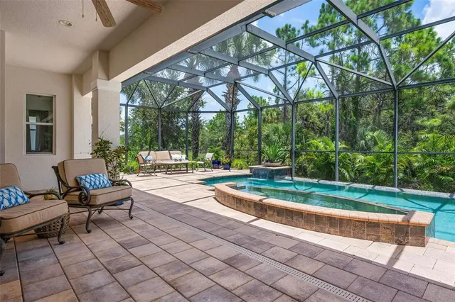 a front view of a house with a garden and yard