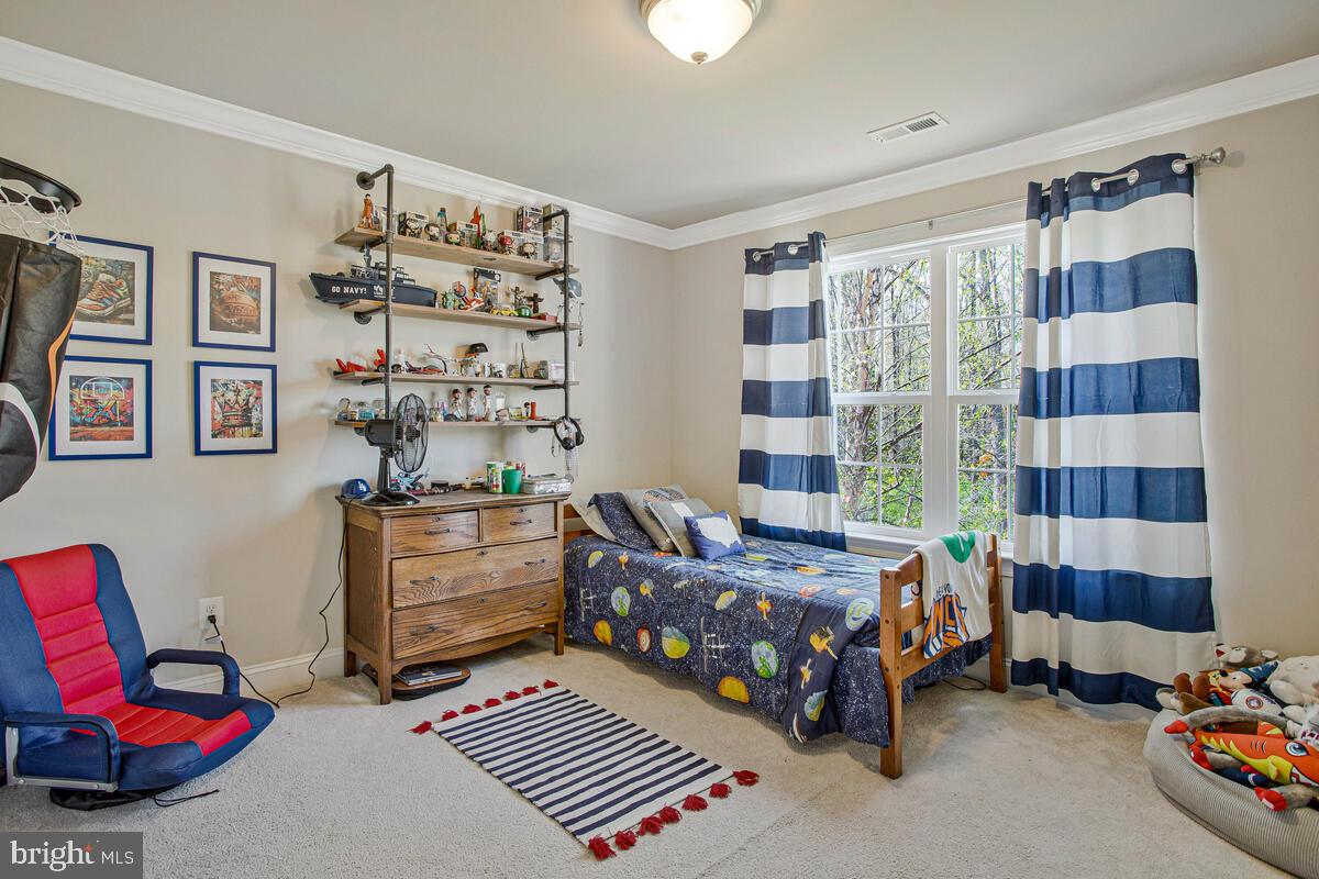 54 Simmons Ridge Road Prince Frederick, MD 20678 - Photo 26 of 55 a bedroom with furniture and a large window