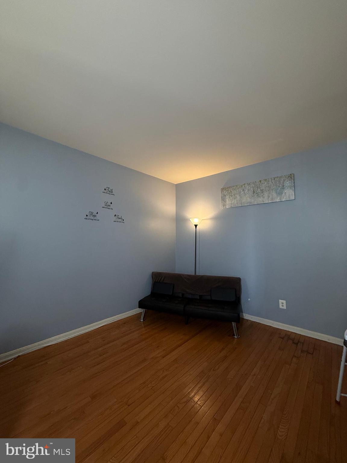 215 Seamaster Road Essex, MD 21221 - Photo 14 of 34 a view of a livingroom with an empty space and wooden floor