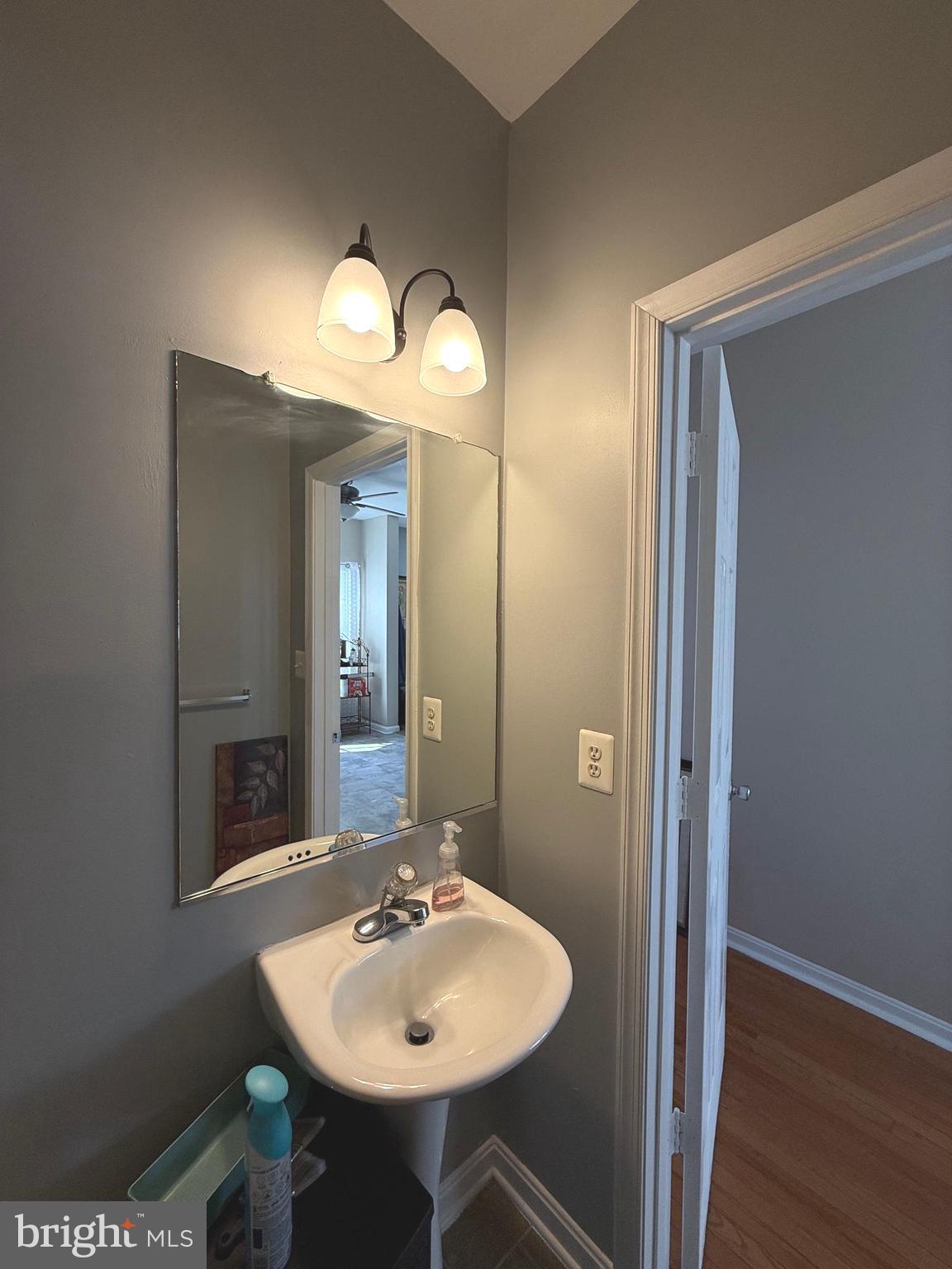 215 Seamaster Road Essex, MD 21221 - Photo 15 of 34 a bathroom with a sink and a mirror