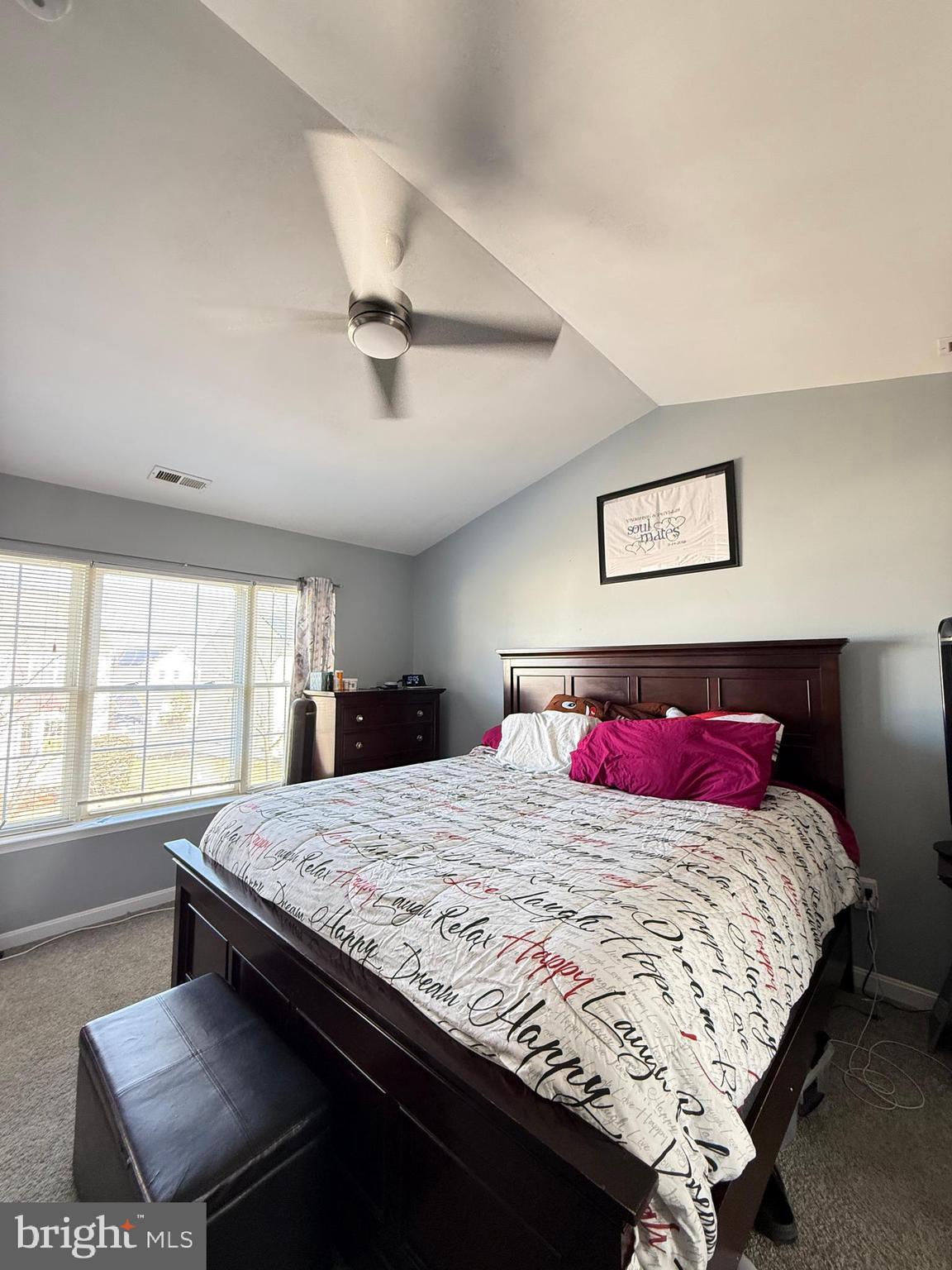 215 Seamaster Road Essex, MD 21221 - Photo 18 of 34 a bedroom with a bed and a chandelier
