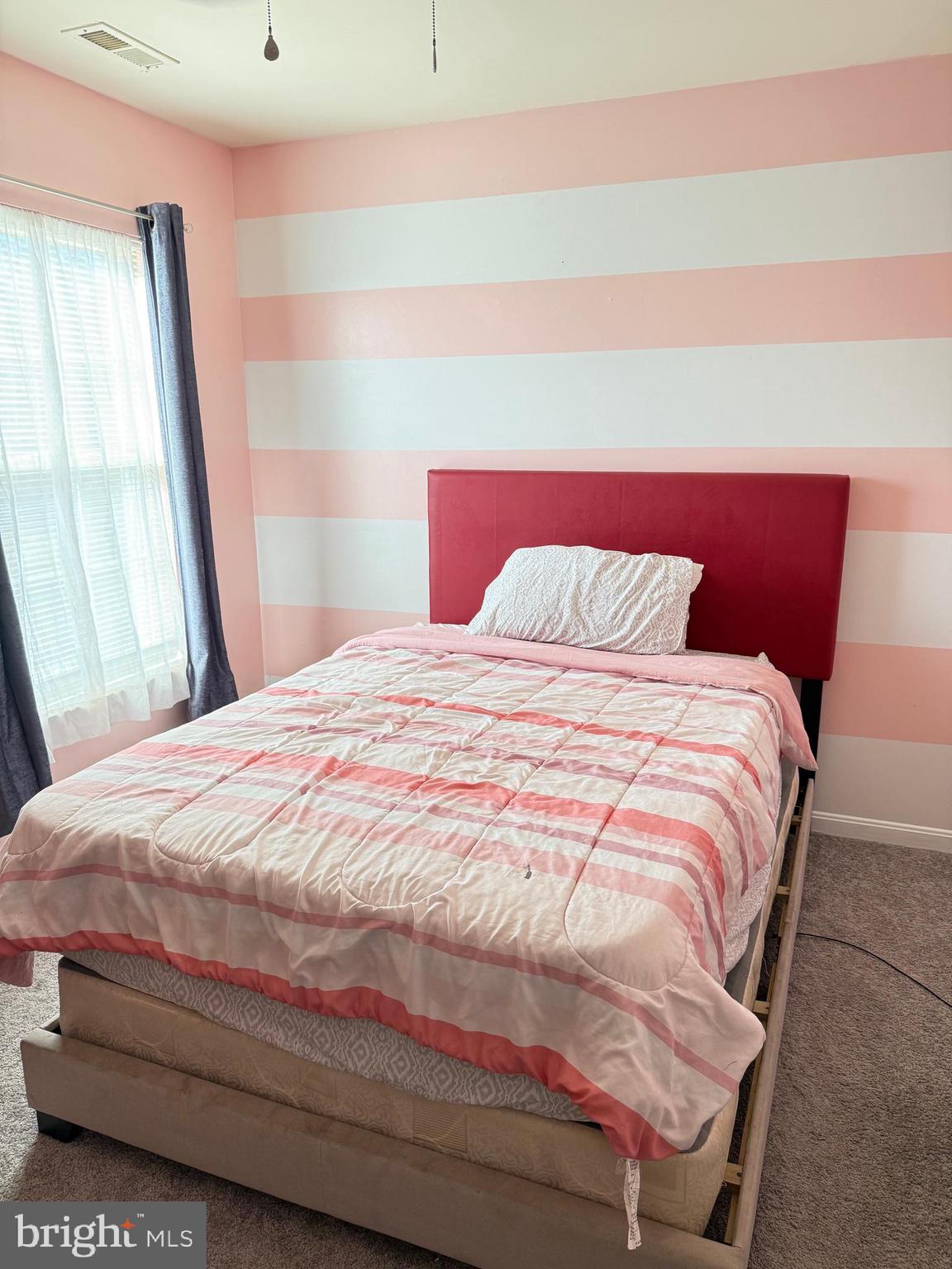 215 Seamaster Road Essex, MD 21221 - Photo 20 of 34 a large bed sitting in a bedroom next to a window