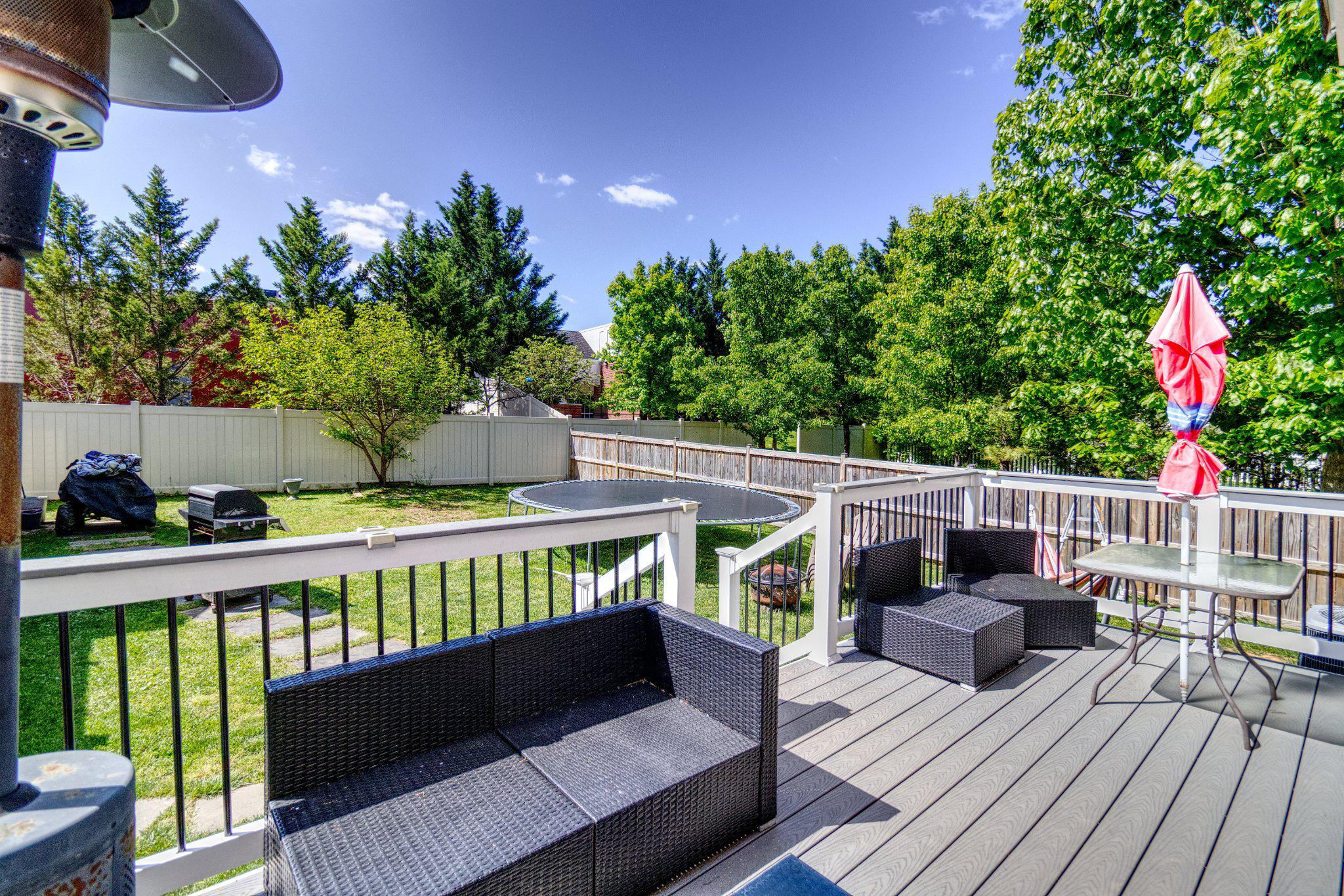 215 Seamaster Road Essex, MD 21221 - Photo 35 of 40 Sunny deck with lush green views.