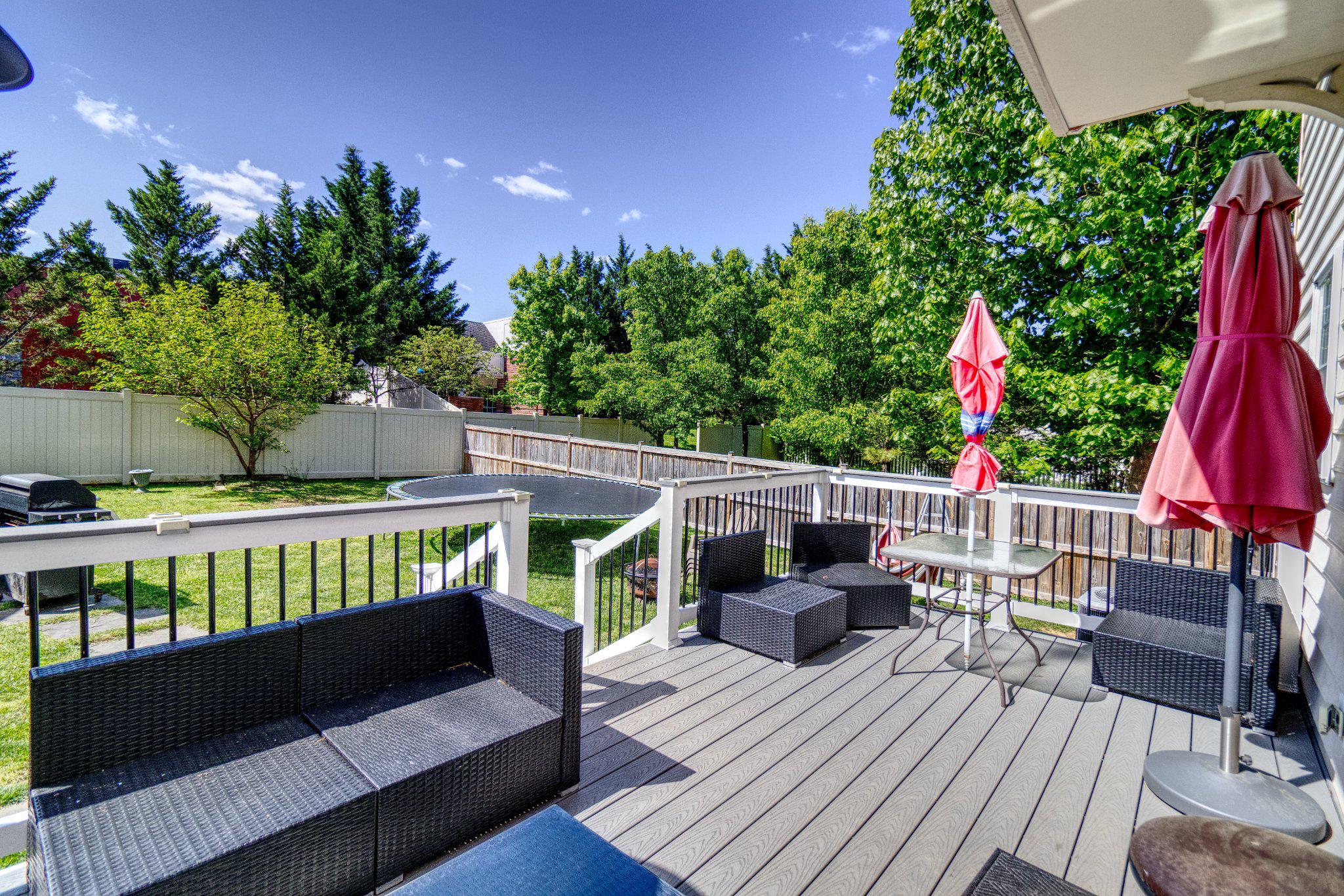 215 Seamaster Road Essex, MD 21221 - Photo 37 of 40 Sunny deck with lush green views.