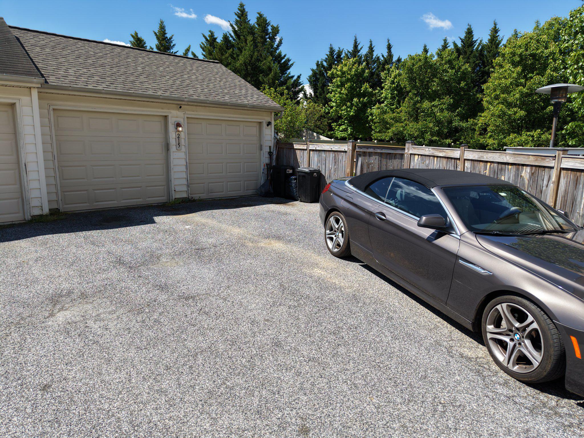215 Seamaster Road Essex, MD 21221 - Photo 4 of 40 Charming driveway with lush greenery.