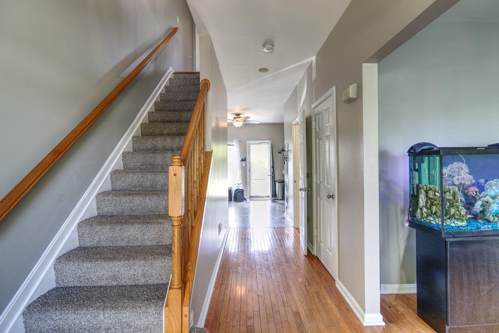 215 Seamaster Road Essex, MD 21221 - Photo 5 of 40 Inviting hallway with elegant staircase.