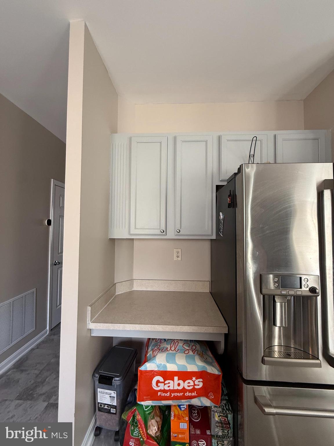 215 Seamaster Road Essex, MD 21221 - Photo 6 of 34 a kitchen with a refrigerator and a stove