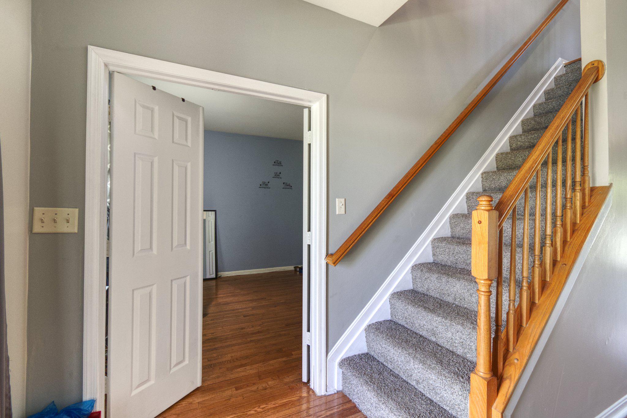 215 Seamaster Road Essex, MD 21221 - Photo 6 of 40 Inviting entryway with staircase charm.
