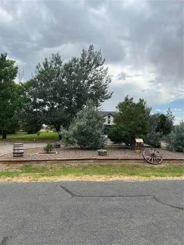 a view of a swimming pool with an outdoor space and seating area
