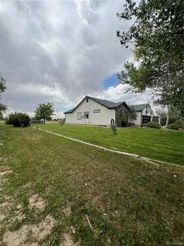 a view of a house with a big yard
