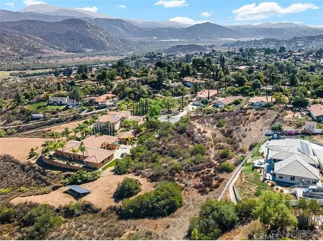 an aerial view of residential house and green space