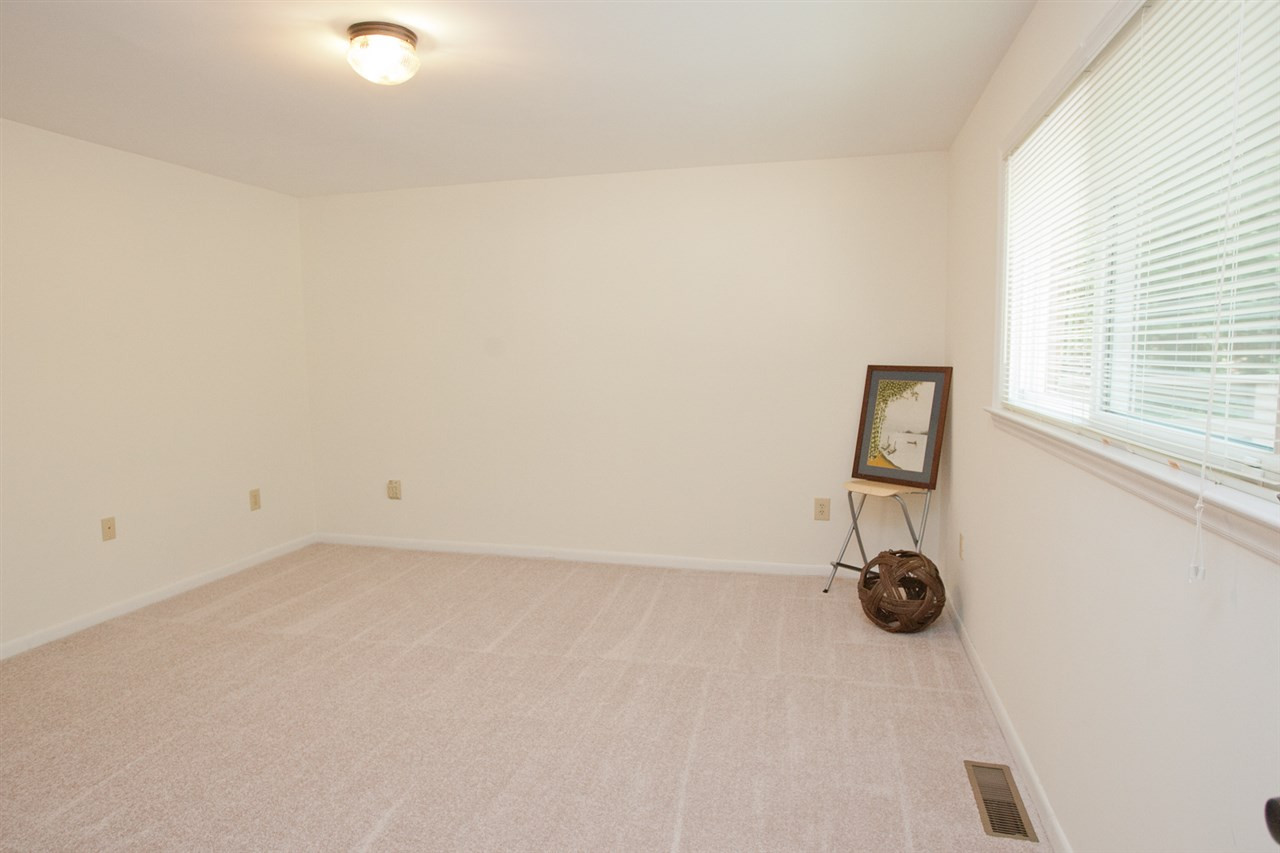 1201 Snow Hill Road Durham, NC 27712 - Photo 14 of 16 This bedroom is located off the back hallway and could be used as an in-law suite or a 4th bedroom with its own bath in the hallway. 4th bedroom
