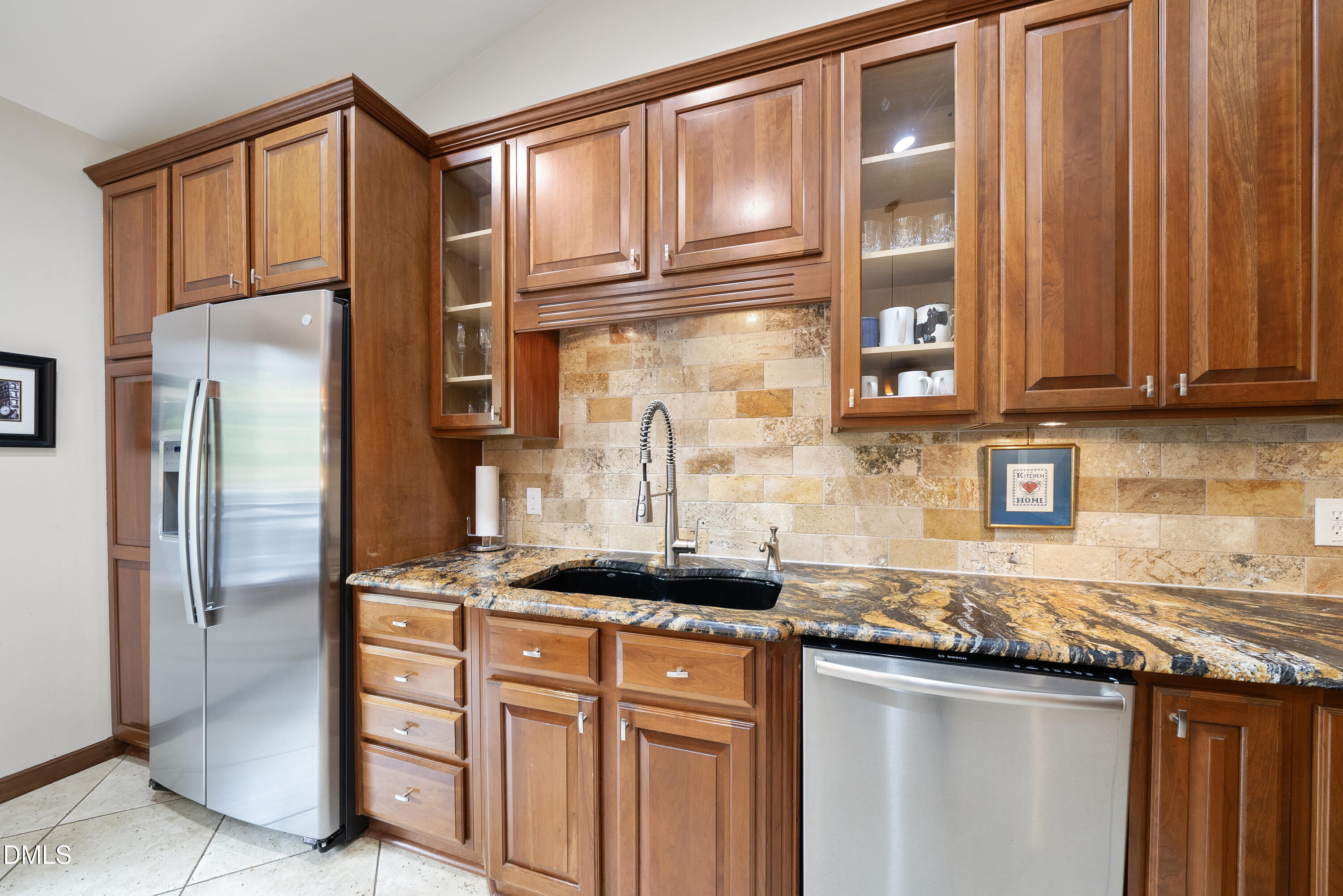 6200 Splitrock Trail Apex, NC 27539 - Photo 4 of 64 a kitchen with stainless steel appliances granite countertop a refrigerator and a sink