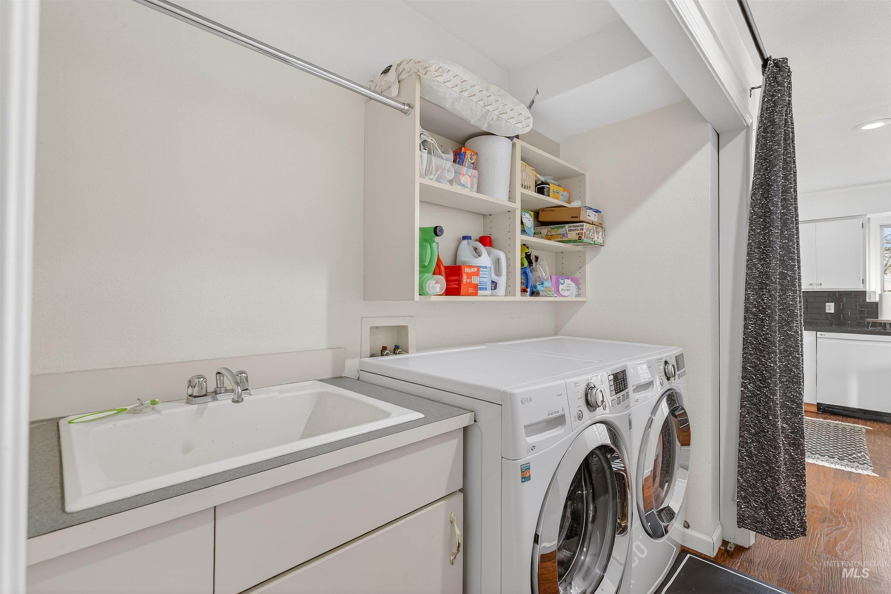 822 15th Avenue Lewiston, ID 83501 - Photo 19 of 44 Laundry room with separate washer and dryer and wood finished floors