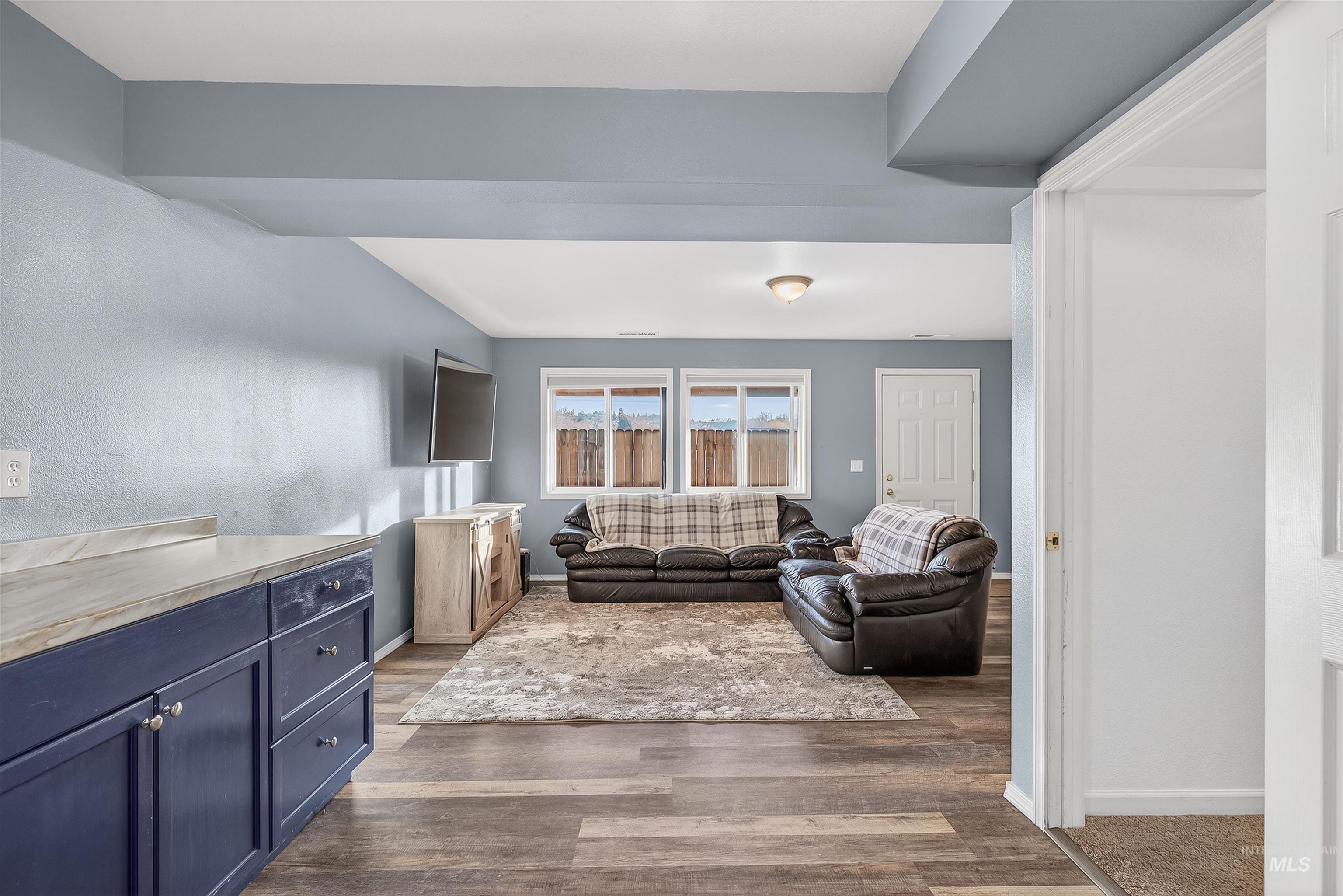 822 15th Avenue Lewiston, ID 83501 - Photo 29 of 44 Living area featuring baseboards and dark wood-style floors
