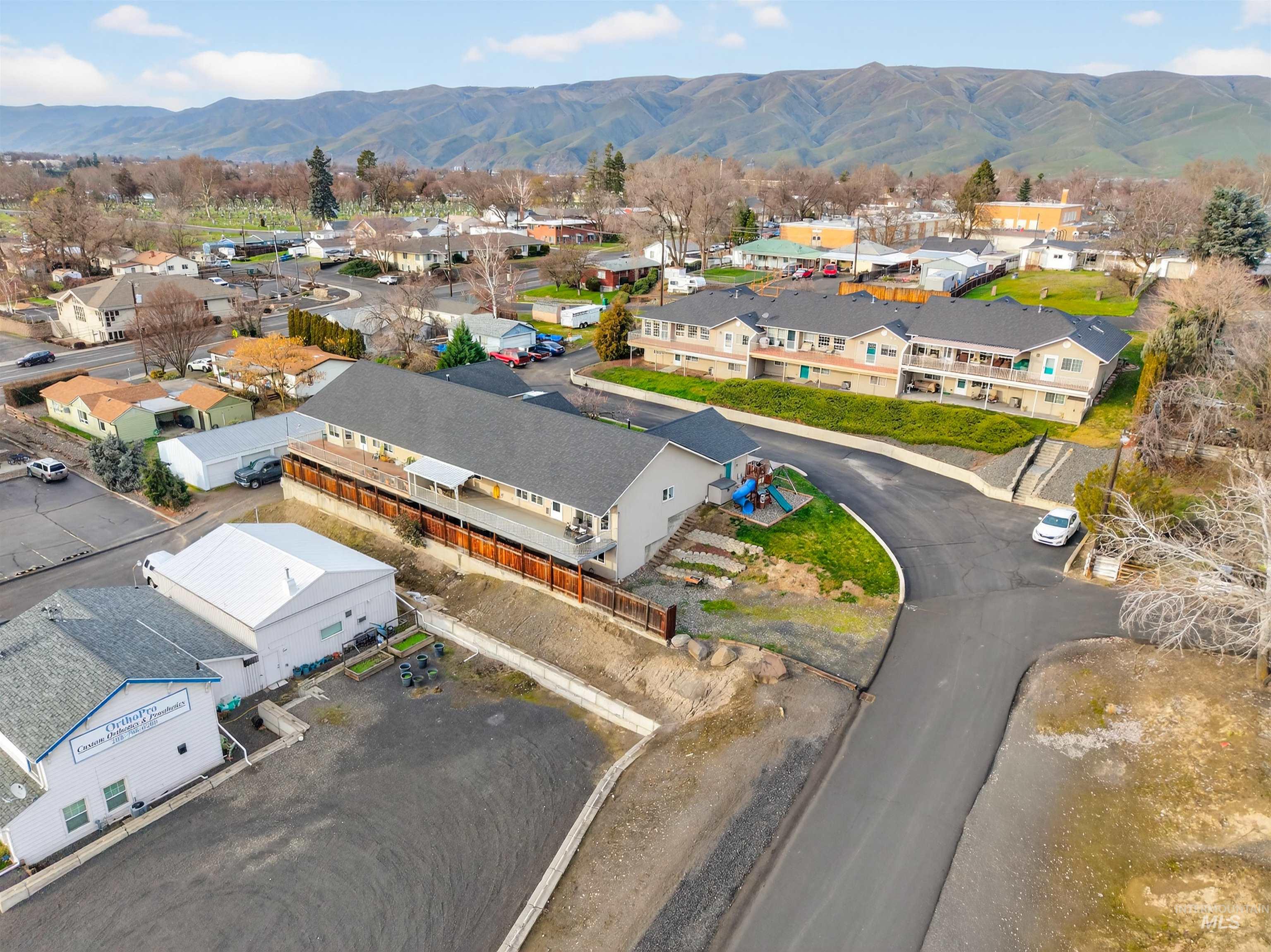 822 15th Avenue Lewiston, ID 83501 - Photo 44 of 44 Aerial perspective of suburban area featuring a mountain backdrop