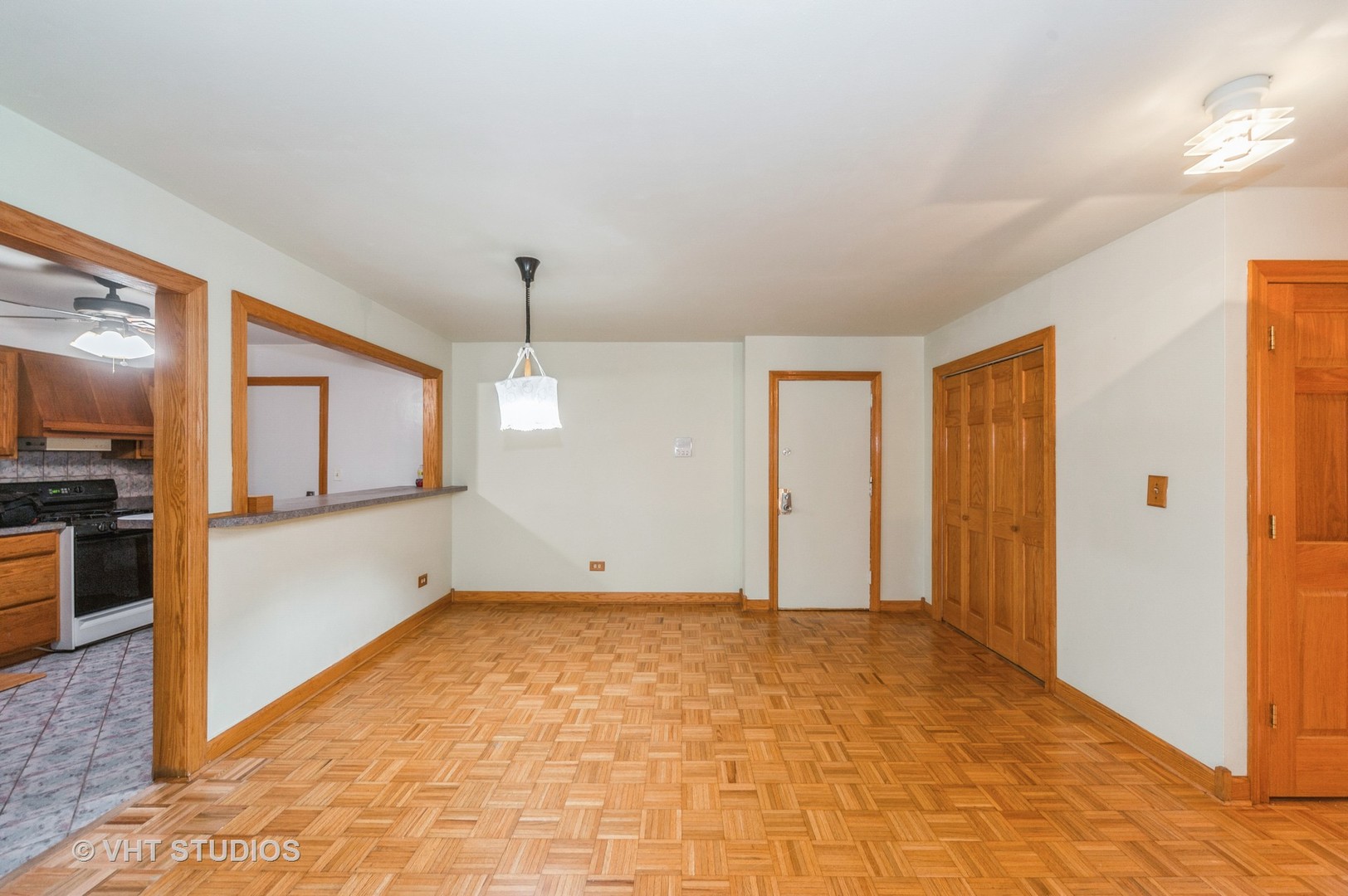 10357 Dearlove Road, Unit 1F Glenview, IL 60025 - Photo 3 of 15 a view of an empty room with window and cabinet