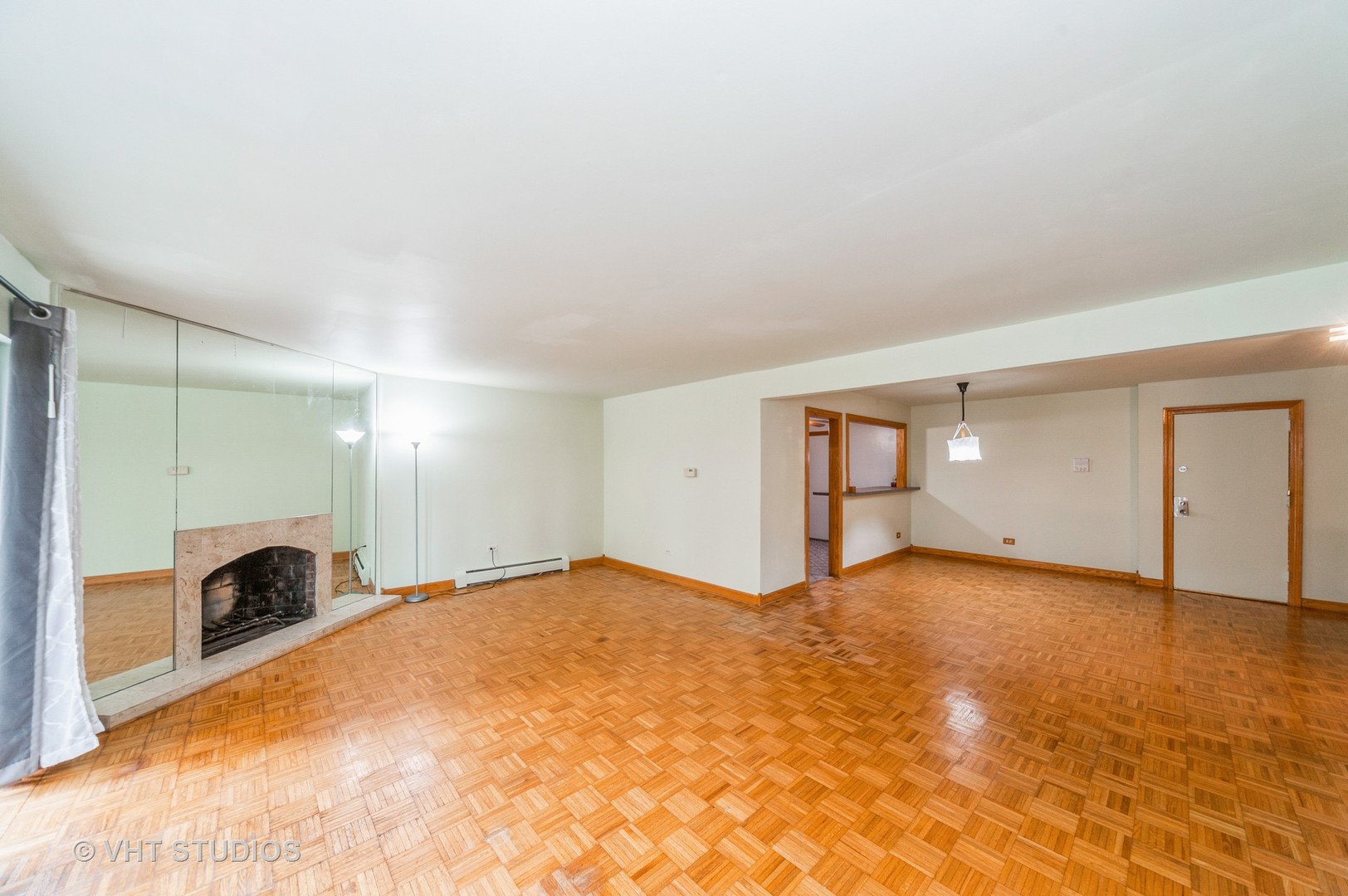 10357 Dearlove Road, Unit 1F Glenview, IL 60025 - Photo 4 of 15 a view of an empty room with a fireplace