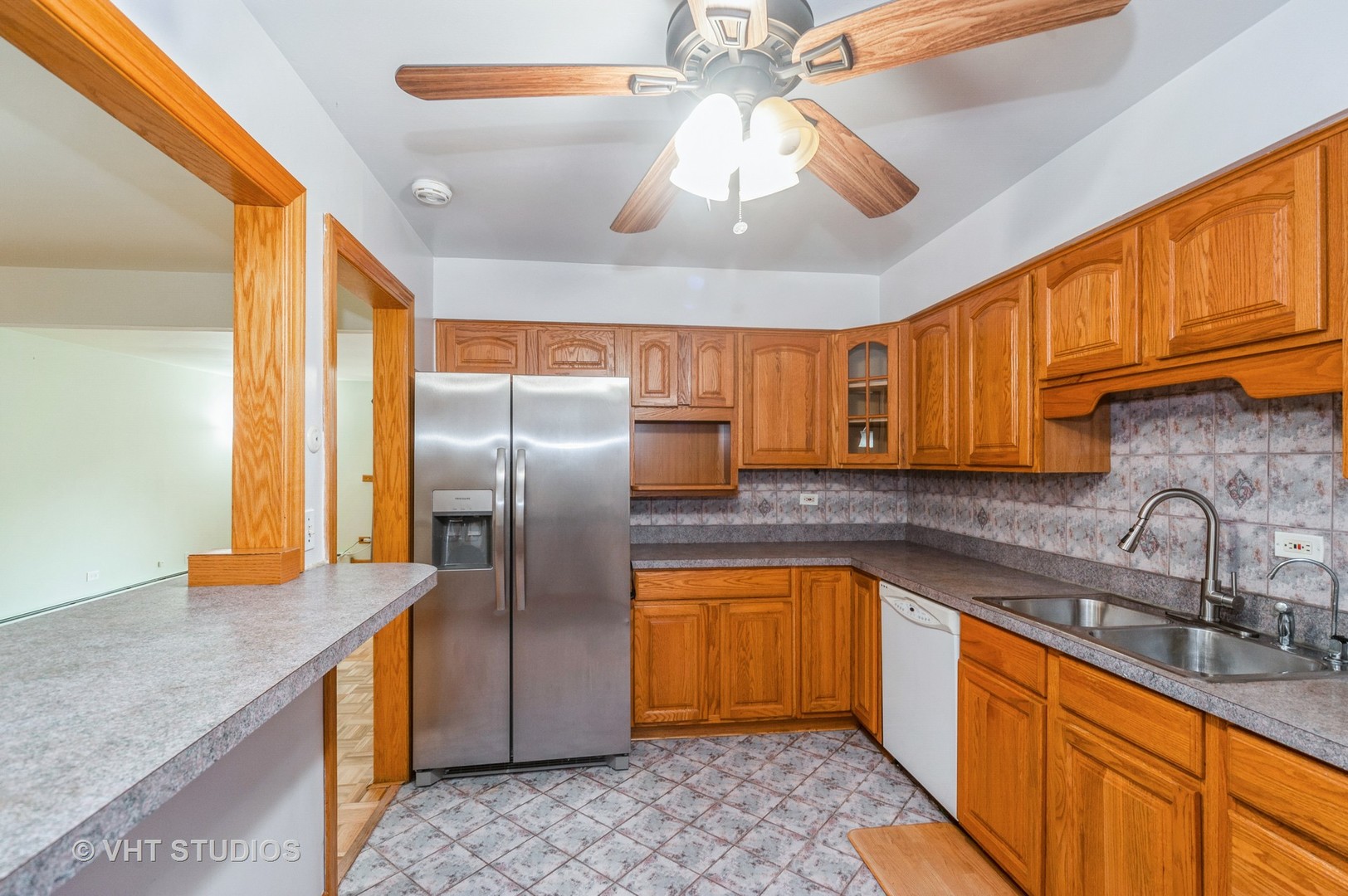 10357 Dearlove Road, Unit 1F Glenview, IL 60025 - Photo 8 of 15 a kitchen with stainless steel appliances granite countertop a sink a stove and refrigerator
