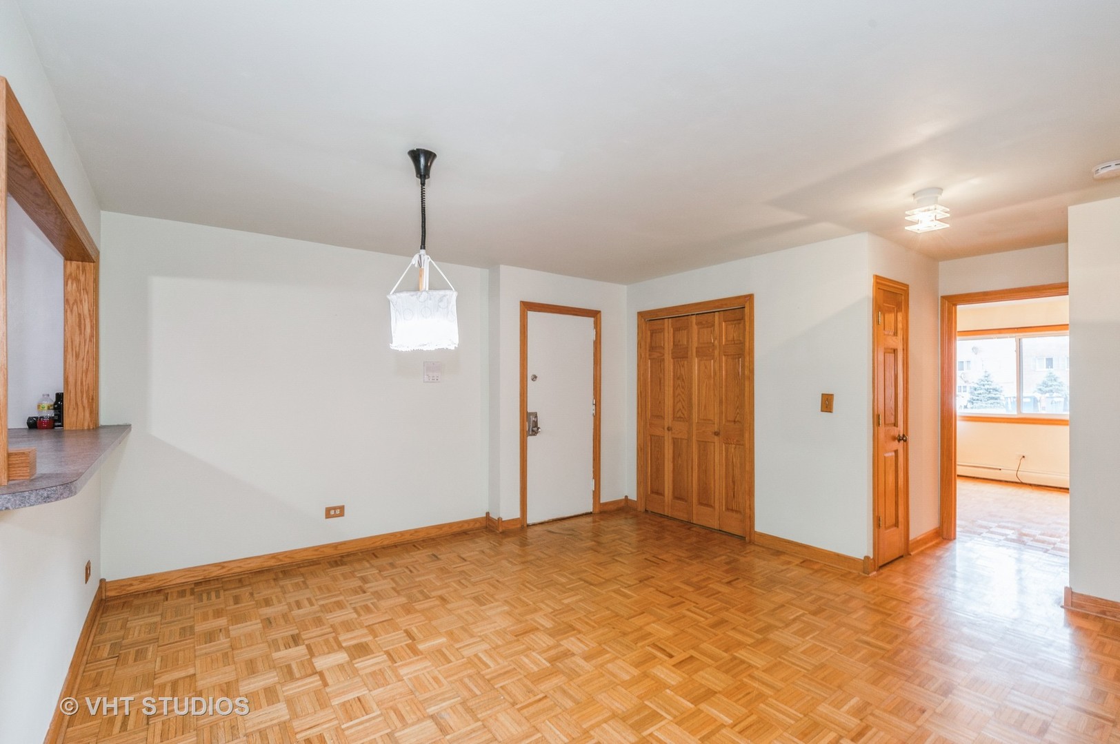 10357 Dearlove Road, Unit 1F Glenview, IL 60025 - Photo 9 of 15 a view of a room with an empty space and wooden floor