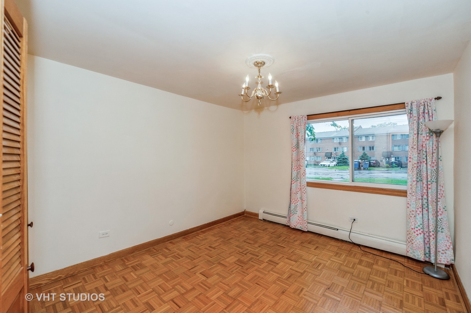 10357 Dearlove Road, Unit 1F Glenview, IL 60025 - Photo 10 of 15 an empty room with a window
