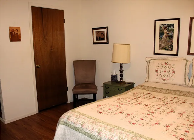 a bedroom with a bed and a table