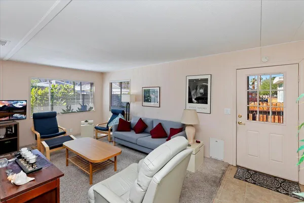 a kitchen with stainless steel appliances granite countertop a sink and a stove