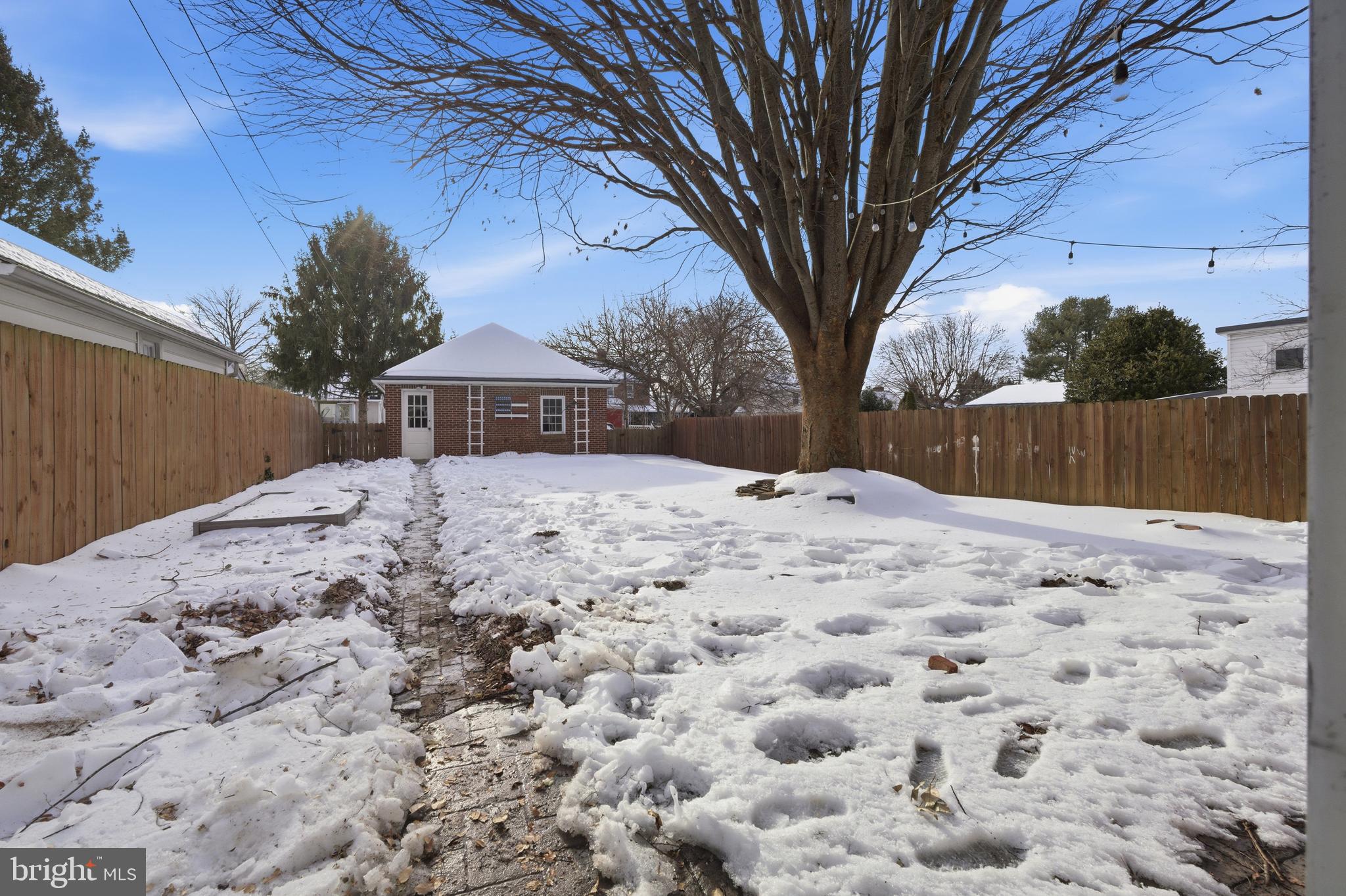 68 Maple Avenue Littlestown, PA 17340 - Photo 26 of 37 a large tree in front of a white house