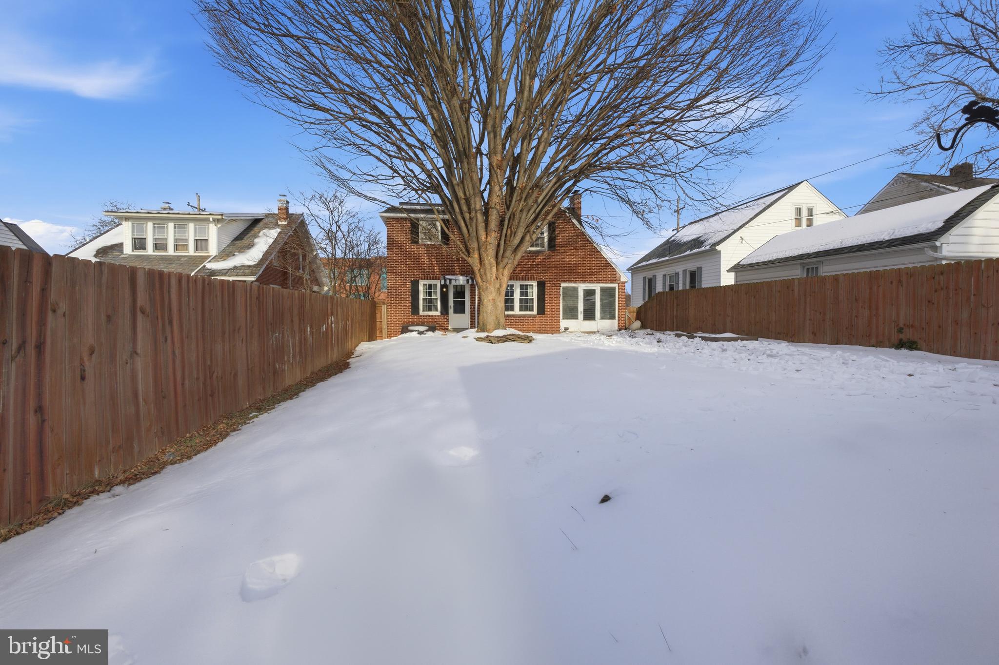 68 Maple Avenue Littlestown, PA 17340 - Photo 27 of 37 a front view of a house with large trees