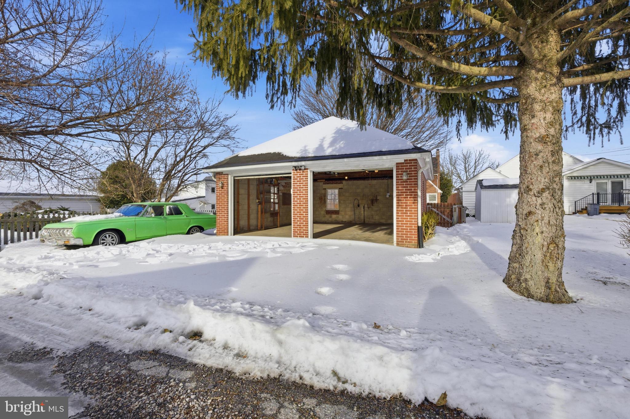 68 Maple Avenue Littlestown, PA 17340 - Photo 29 of 37 a front view of a house with a yard and potted plants