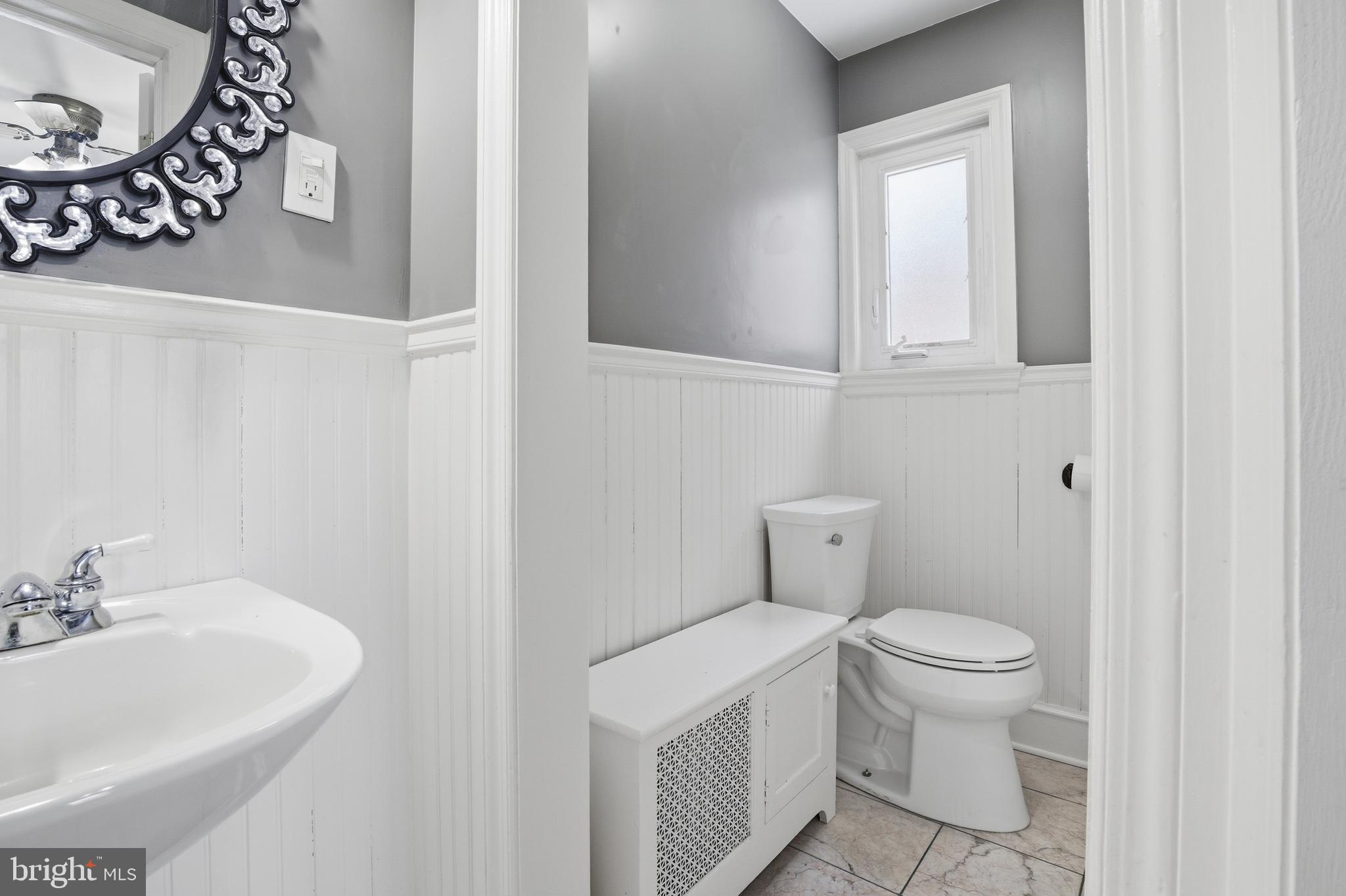 68 Maple Avenue Littlestown, PA 17340 - Photo 8 of 37 a white toilet sitting next to a bathroom sink