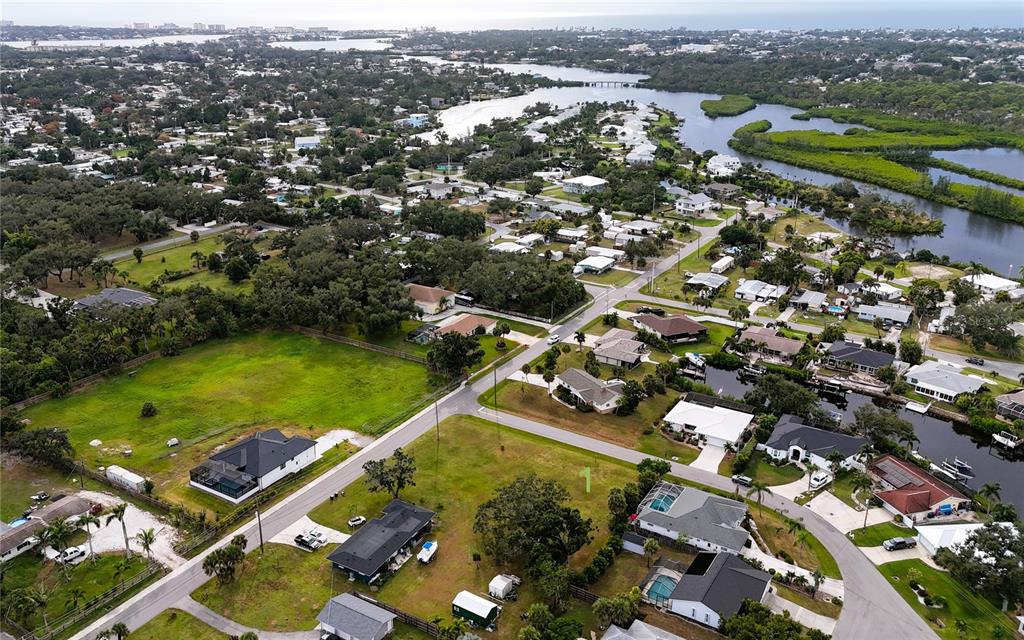 Bonito Avenue Nokomis, FL 34275 - Photo 5 of 6 an aerial view of a residential houses with outdoor space and river view