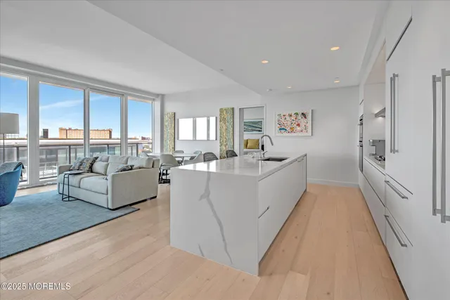 a bathroom with a double vanity sink mirror and shower