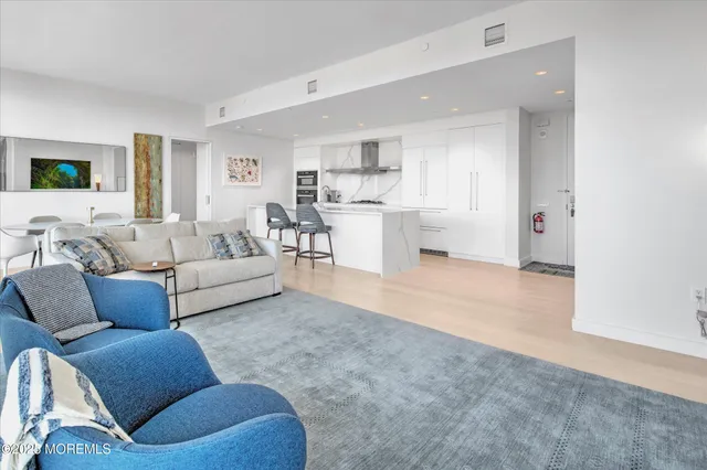 a living room with furniture and a table