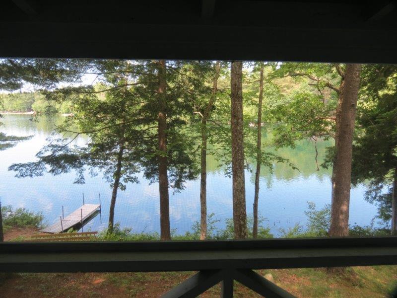 91 Coffee Pond Road Casco, ME 04015 - Photo 10 of 35 View of water from screened-in porch.