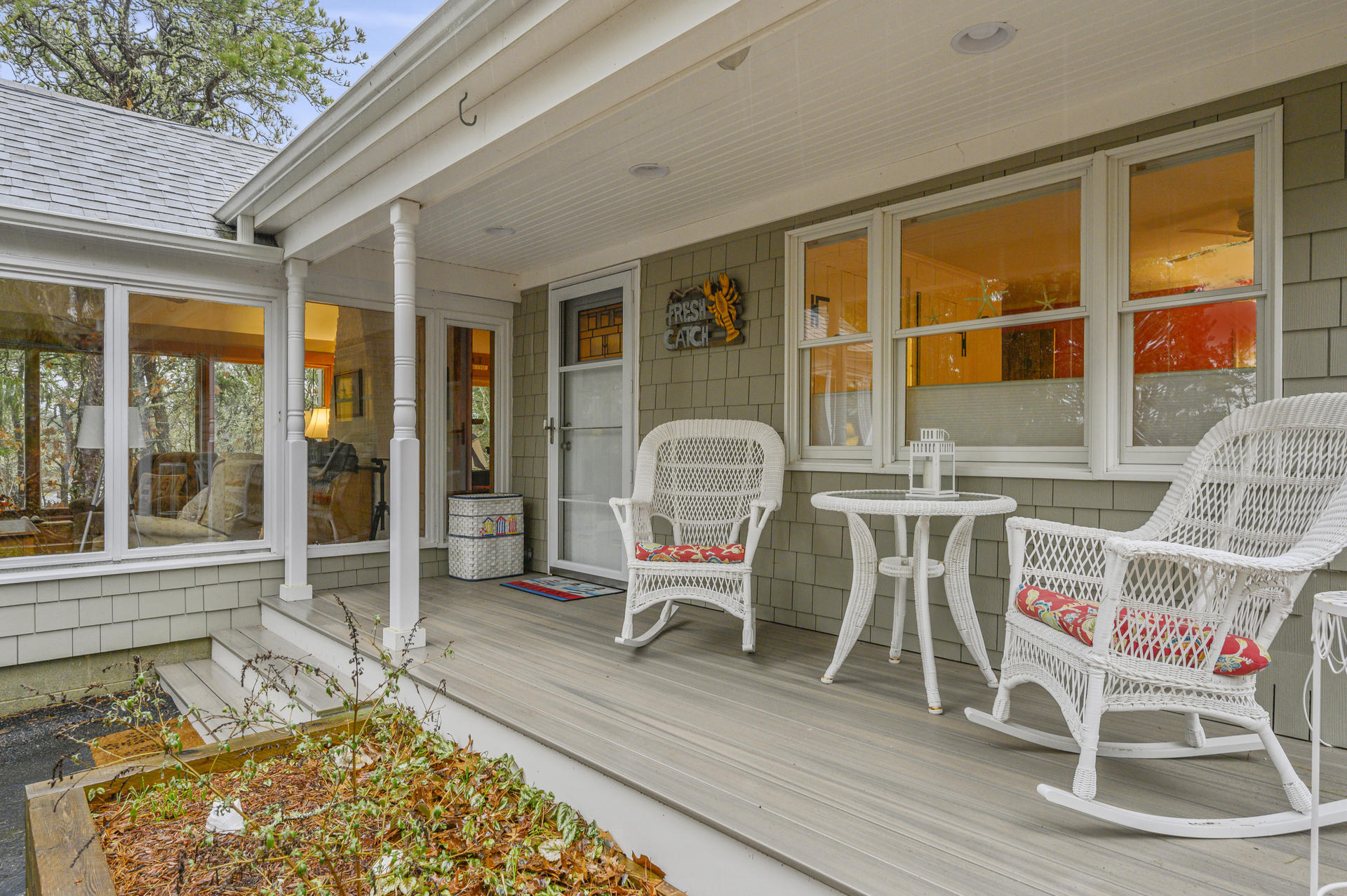 88 Deep Hole Road Harwich Port, MA 02646 - Photo 1 of 30 a balcony with table and chairs