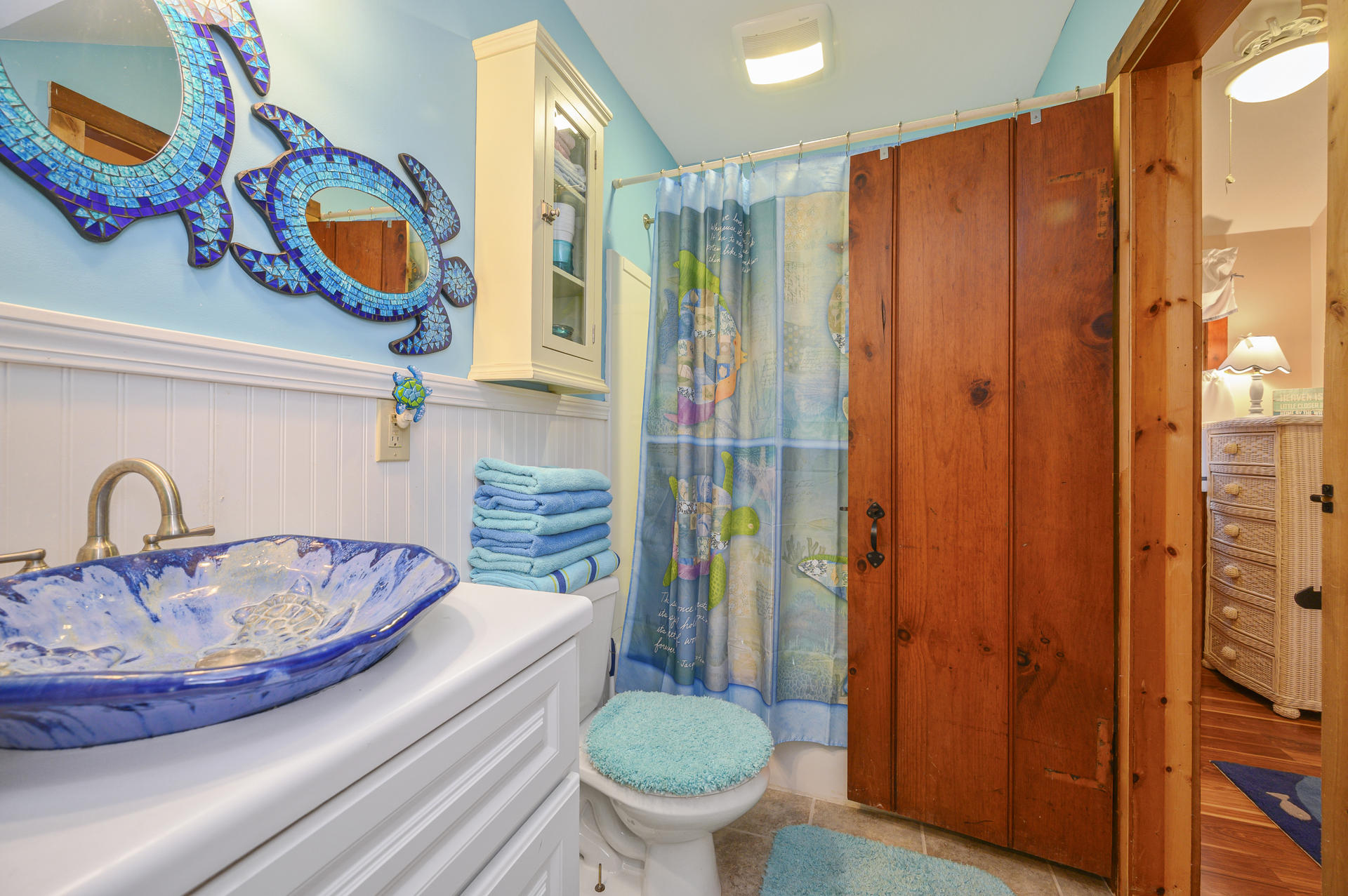 88 Deep Hole Road Harwich Port, MA 02646 - Photo 18 of 30 a bathroom with a sink a toilet and shower curtain