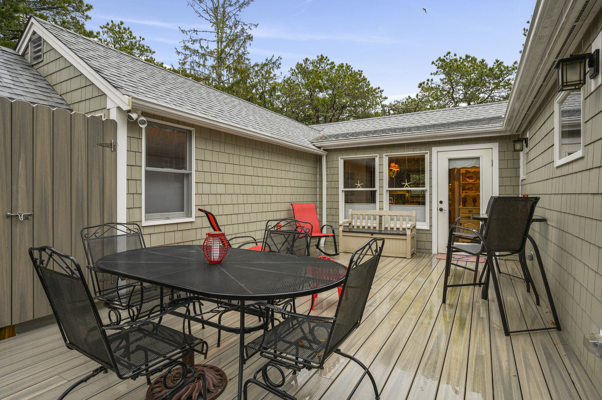 88 Deep Hole Road Harwich Port, MA 02646 - Photo 19 of 30 a backyard of a house with table and chairs