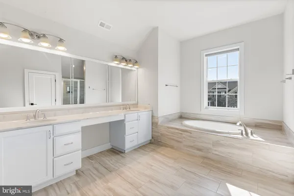a bathroom with a granite countertop sink mirror and a