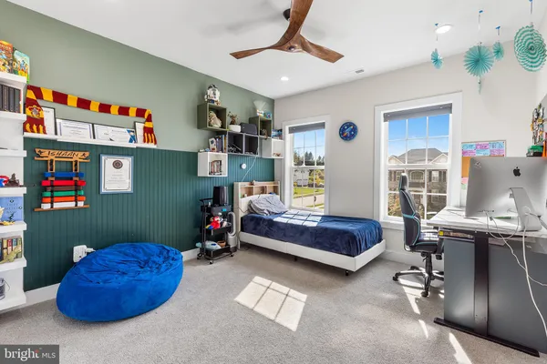 a bedroom with furniture and a window