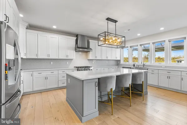 a kitchen with counter space cabinets and appliances