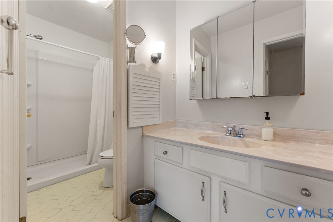 1760 Gloucester Road Gloucester Point, VA 23062 - Photo 42 of 47 Full bathroom featuring a white vanity with integr