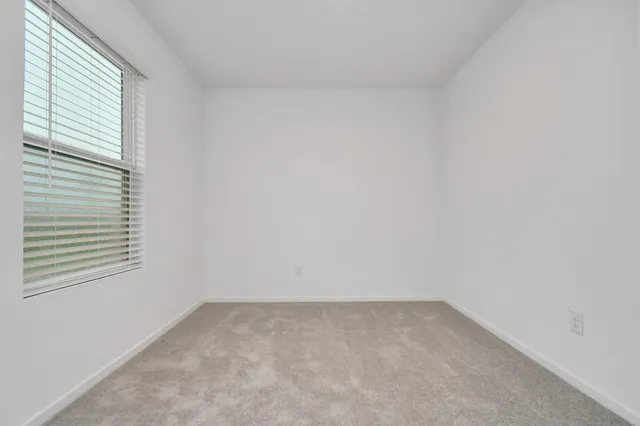 a view of a room that has a window in it