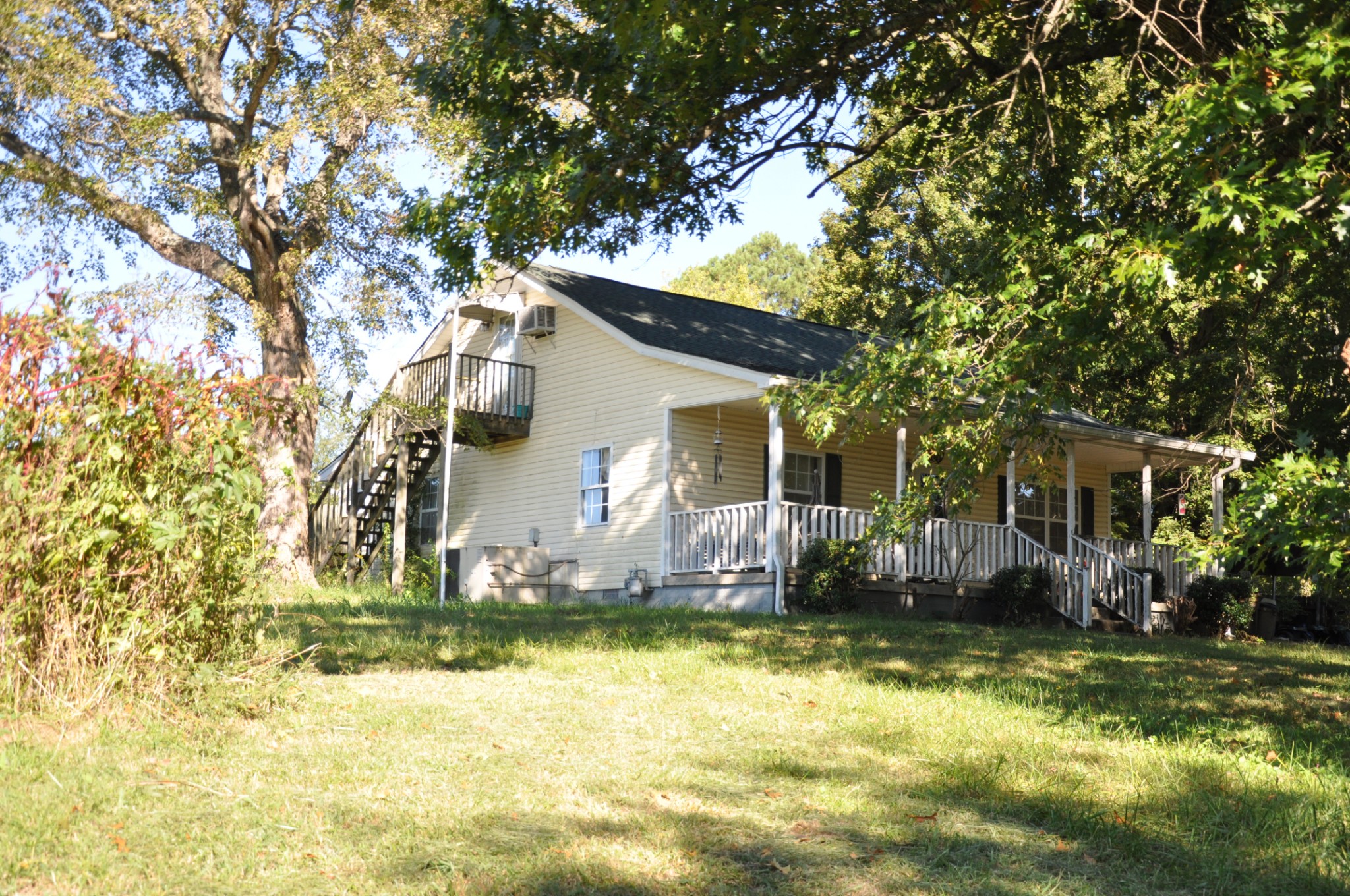 4168 Roy Cole Road Springfield, TN 37172 - Photo 3 of 31 a front view of house with yard and trees in the background