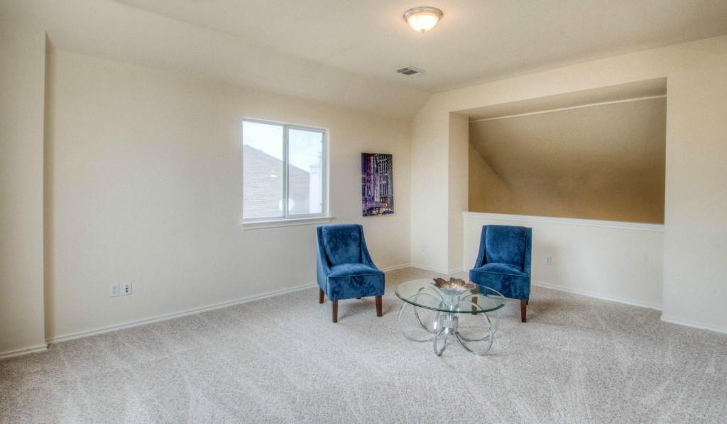 14813 Jacks Pond Road Austin, TX 78728 - Photo 14 of 29 Carpeted bonus room featuring a window with blinds, a built-in architectural niche, and a flush-mount ceiling light fixture
